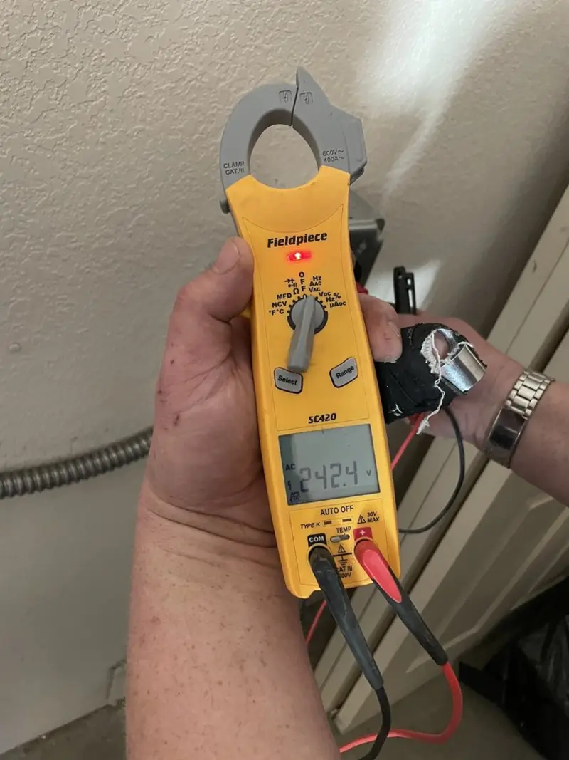 Voltage testing with clamp meter during Outlet Installation in Crystal City